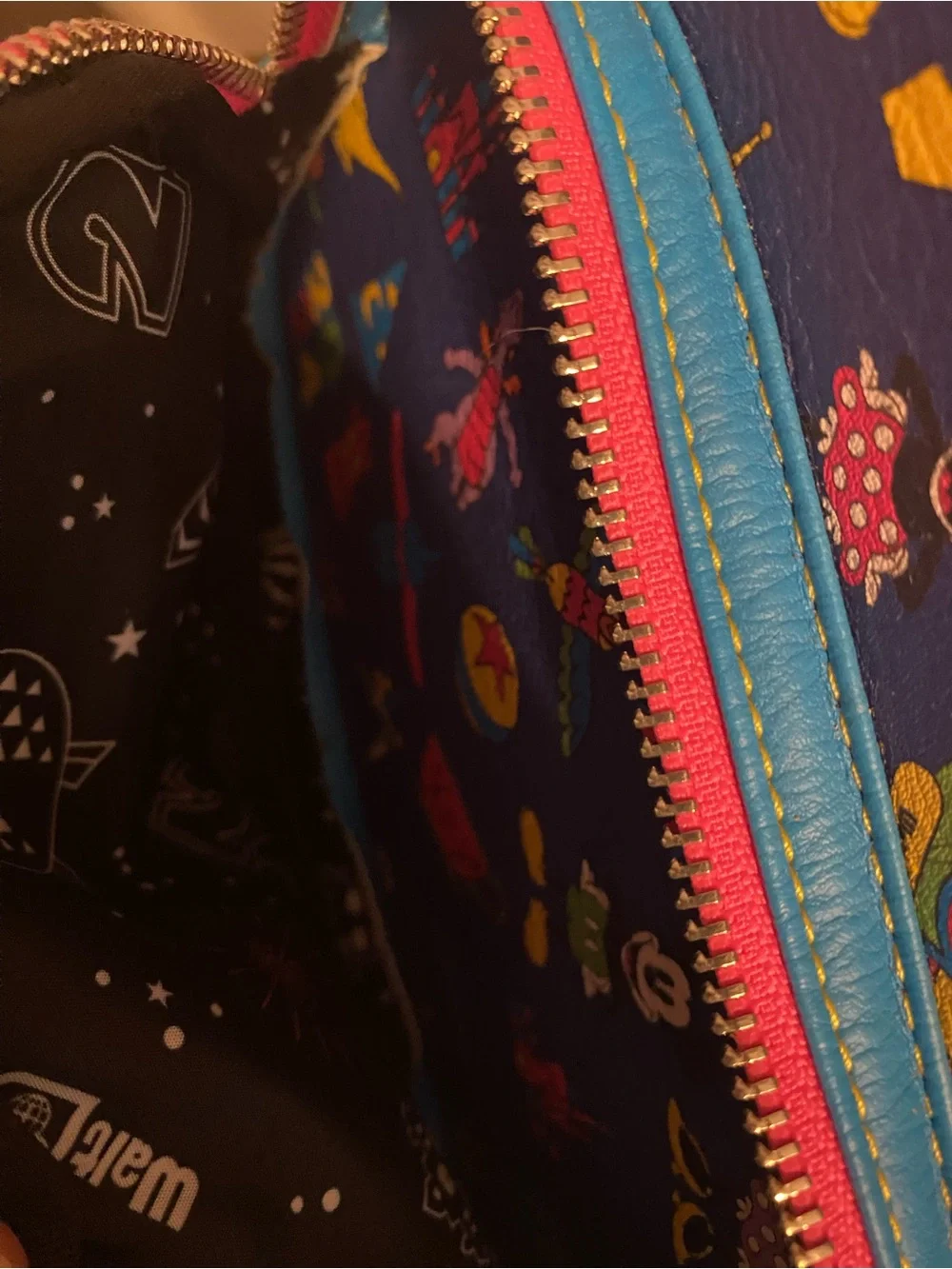 Loungefly Blue Mini Backpack with Pink Trim and Multicolor Disney Icons